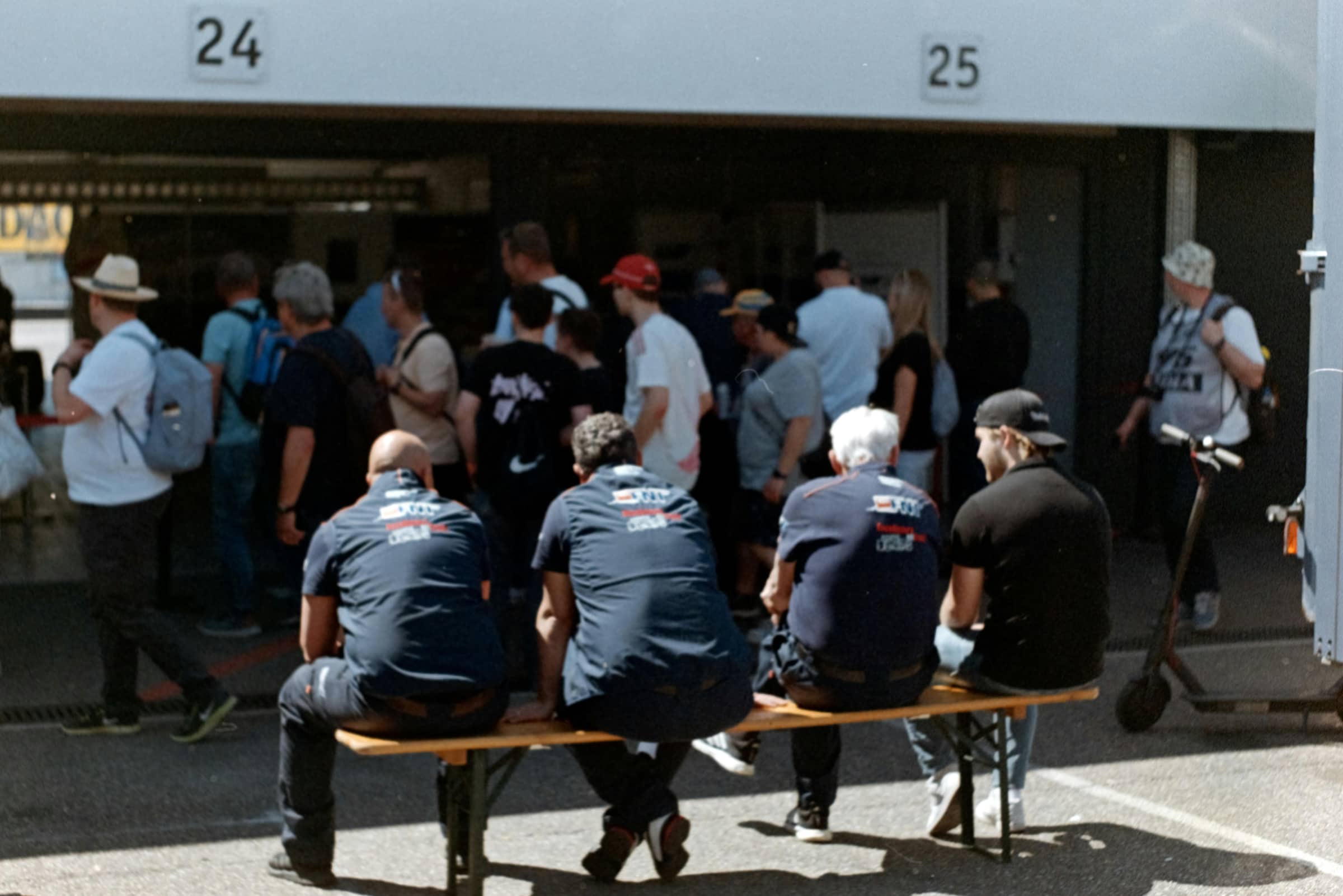 Crowd gathered at an event entrance on a sunny day, matching a World Cup 2026 last-minute tickets versus resale marketplace guide.