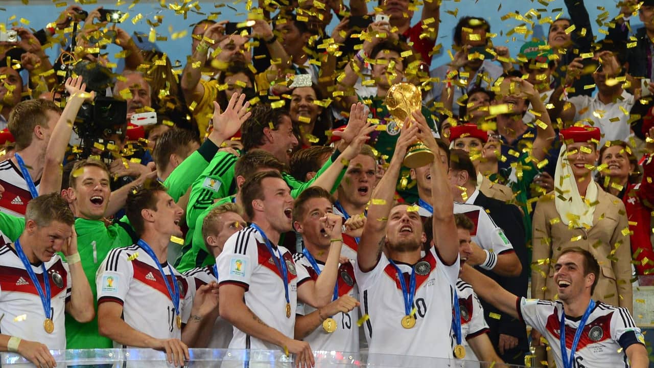 World Cup trophy ceremony with players celebrating under gold confetti