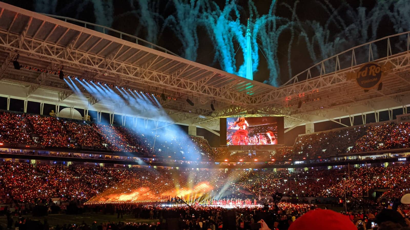 Stadium halftime show lights and crowd before a major football final performance