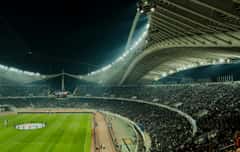 A crowded World Cup stadium at night before the quarterfinals.